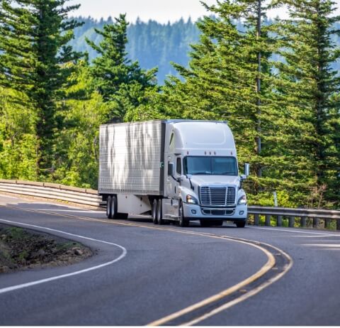 semi truck driving down the road