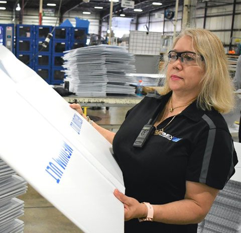 employee holding printed sign