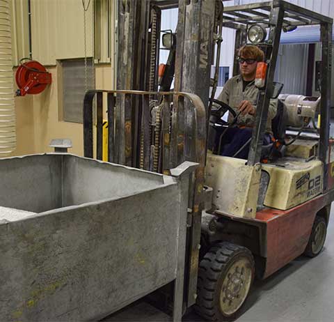 man operating forklift