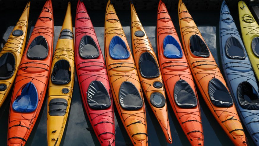 assorted kayaks on doc
