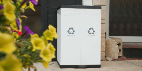 Recycling bin outside on sidewalk