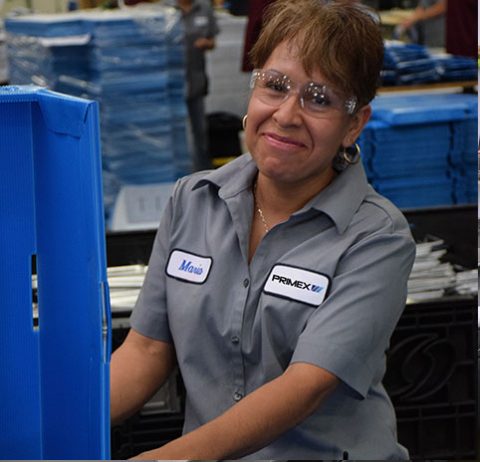 Team member smiles doing her work