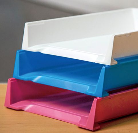 three plastic trays stack on top of each other on a desk